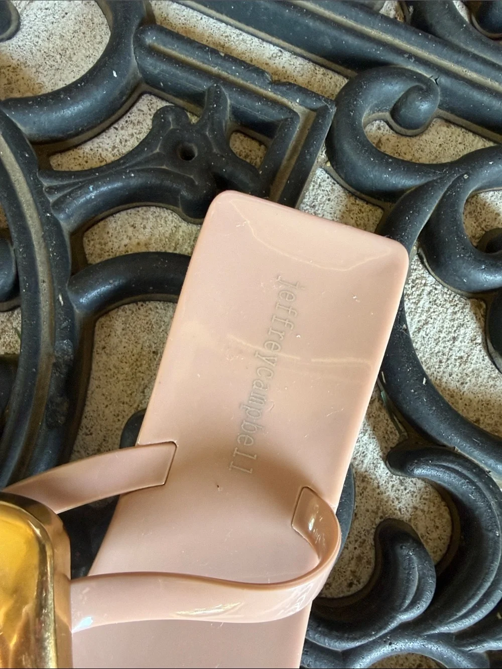 Women’s blush pink thong sandals with gold buckle